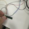 60 GHz AiP radar board with its 6-wire lead ending in female Dupont plugs, ready for 2.54 mm headers